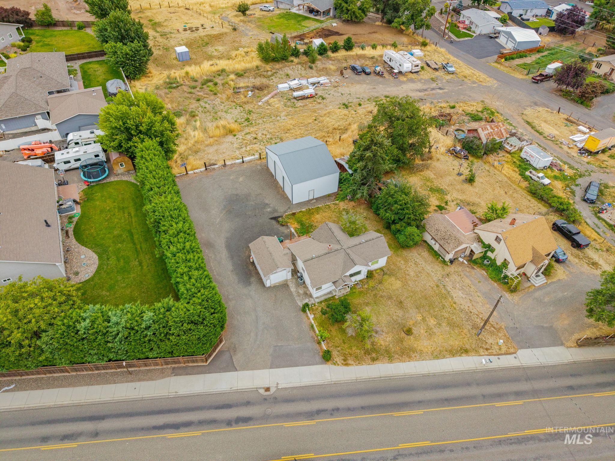 2255 Appleside Boulevard Clarkston, WA 99403 - Photo 36 of 41 Aerial view showcasing the property with a detached garage and a large metal outbuilding