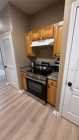 a kitchen with a stove and a microwave