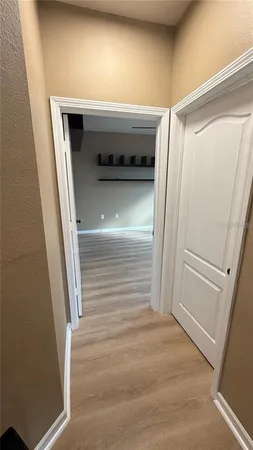 a view of an empty room with a window