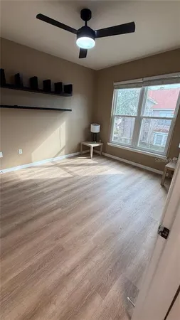 a bedroom with a bed and a chair