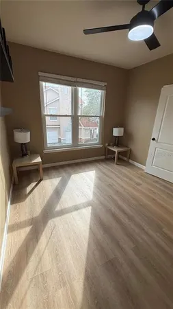 a kitchen with stainless steel appliances a refrigerator and wooden floor