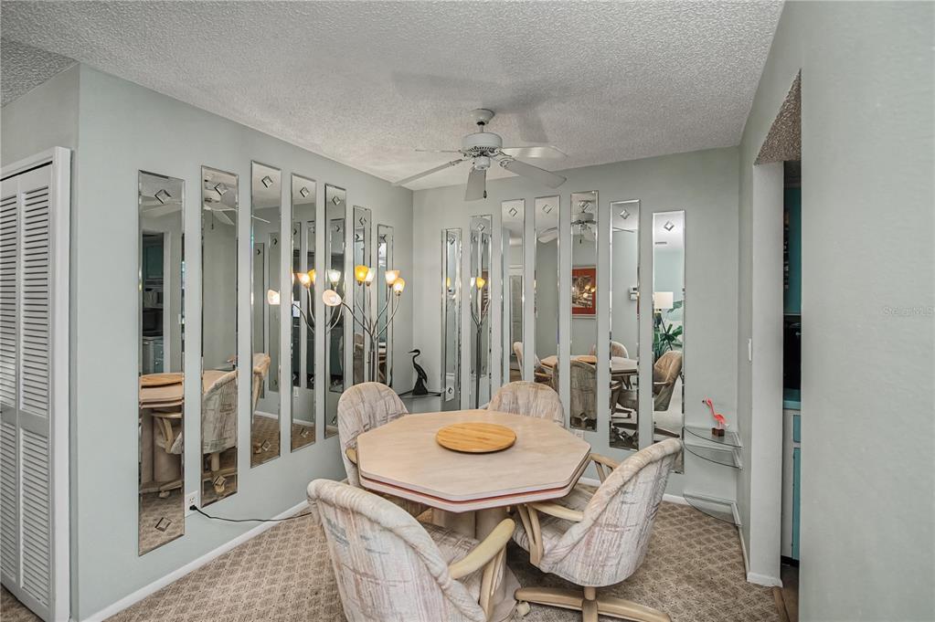 22375 Edgewater Drive, Unit 238 Punta Gorda, FL 33980 - Photo 18 of 57 a view of a dining room with furniture window and wooden floor