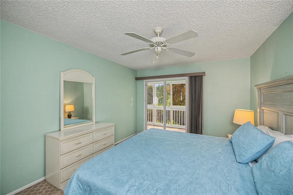 22375 Edgewater Drive, Unit 238 Punta Gorda, FL 33980 - Photo 23 of 57 a bedroom with furniture and a window