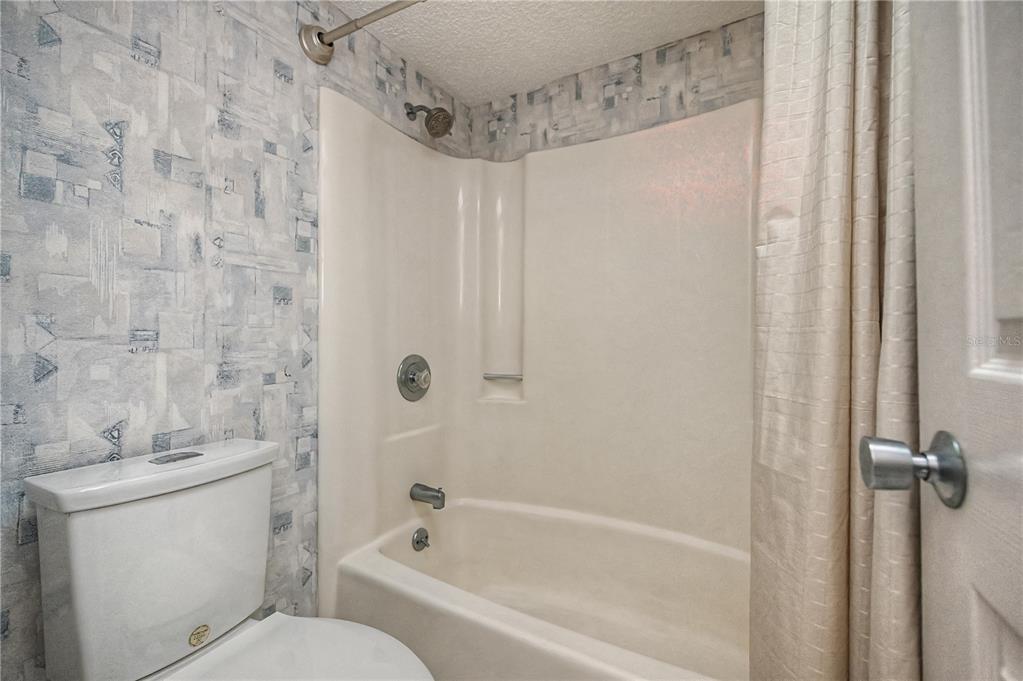 22375 Edgewater Drive, Unit 238 Punta Gorda, FL 33980 - Photo 33 of 57 a bathroom with a toilet and shower