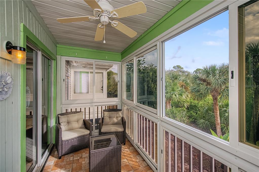22375 Edgewater Drive, Unit 238 Punta Gorda, FL 33980 - Photo 36 of 57 a view of a porch with furniture