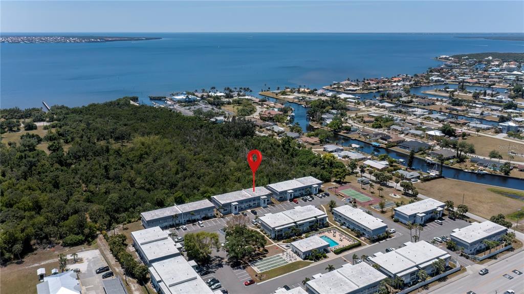 22375 Edgewater Drive, Unit 238 Punta Gorda, FL 33980 - Photo 57 of 57 an aerial view of a city with ocean view in back