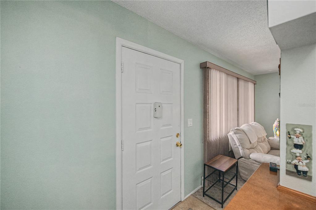 22375 Edgewater Drive, Unit 238 Punta Gorda, FL 33980 - Photo 7 of 57 a view of a livingroom with furniture and a window