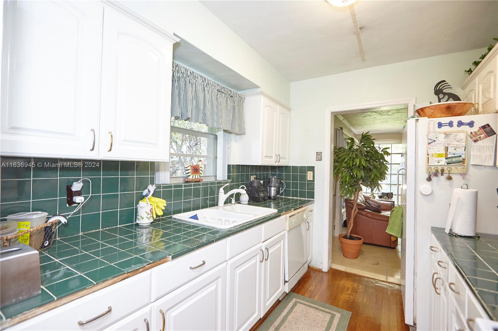 Central Gables Coral Gables, FL 33134 - Photo 27 of 45 Kitchen connecting the dining room and the family room