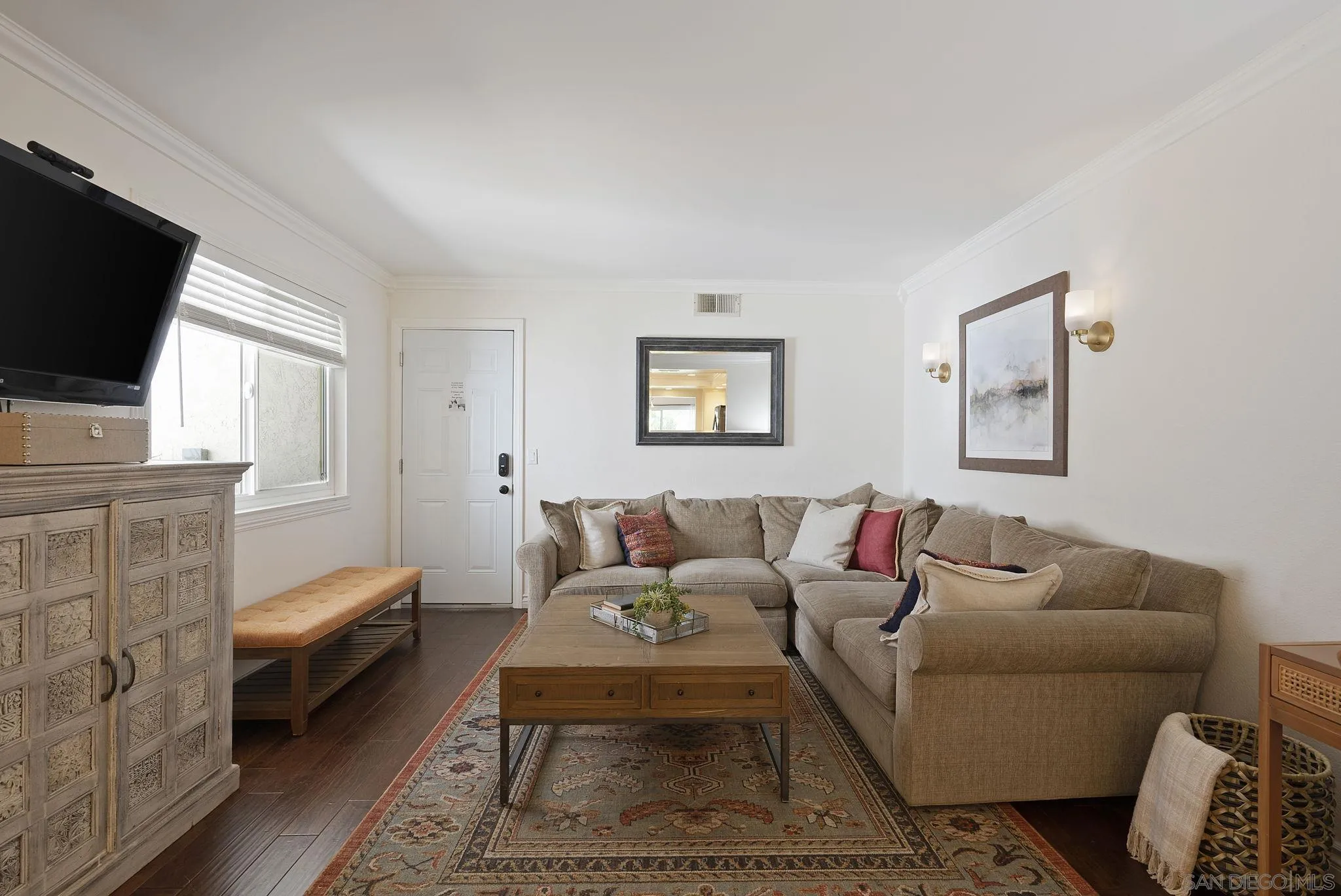 6561 Corte Cisco Carlsbad, CA 92009 - Photo 15 of 36 a living room with furniture and a flat screen tv