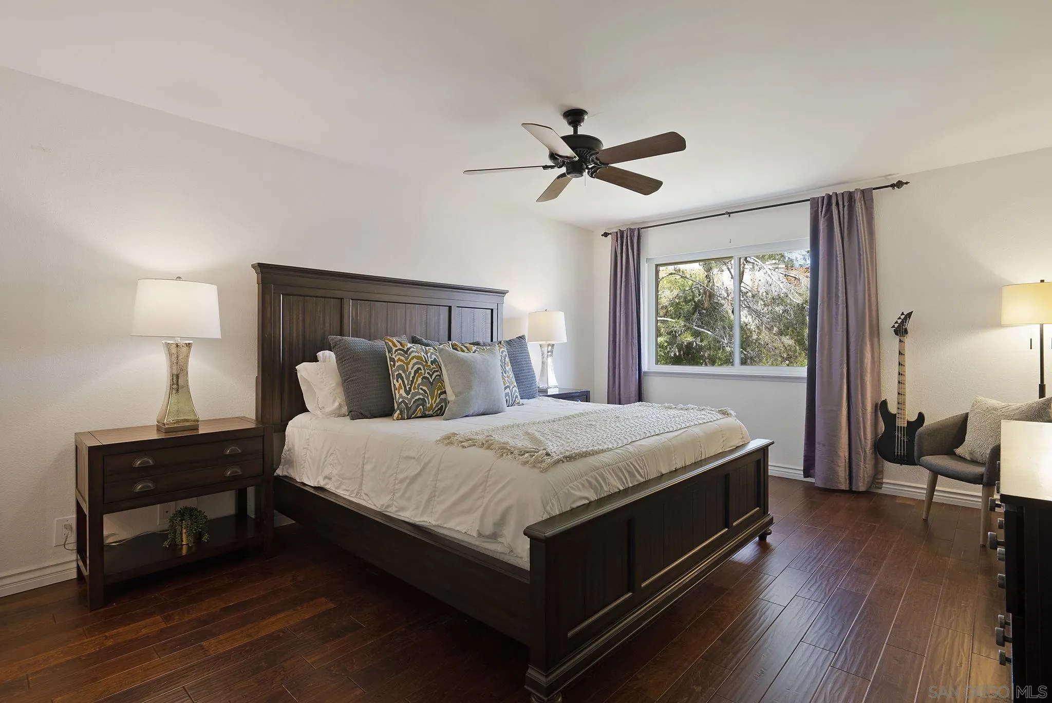 6561 Corte Cisco Carlsbad, CA 92009 - Photo 19 of 36 a bed sitting in a bedroom next to a window