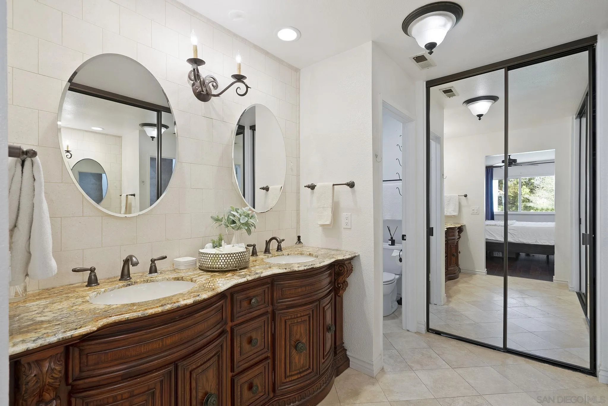 6561 Corte Cisco Carlsbad, CA 92009 - Photo 20 of 36 a spacious bathroom with a double vanity sink mirror and double