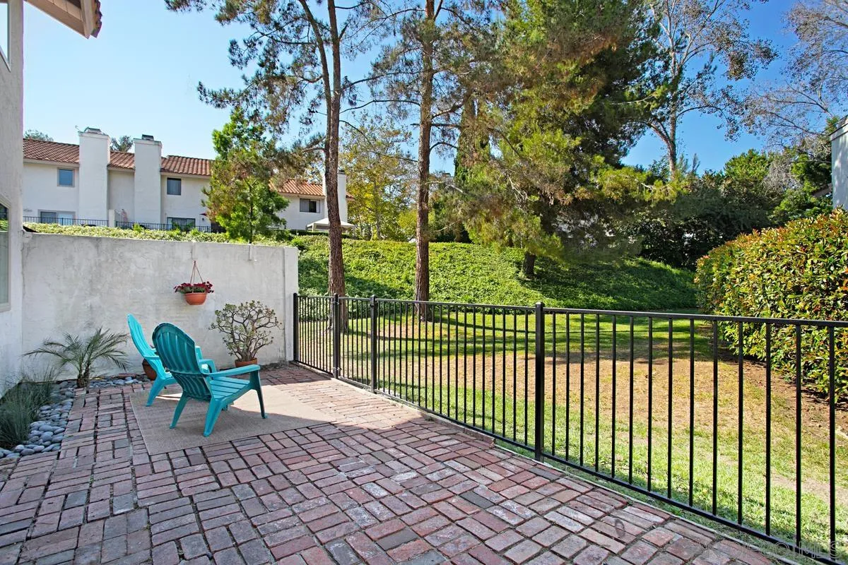 6561 Corte Cisco Carlsbad, CA 92009 - Photo 26 of 36 a view of a balcony with a potted plant and a ceiling fan