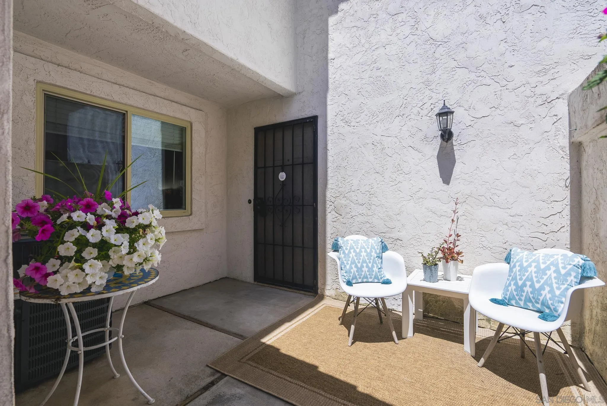 6561 Corte Cisco Carlsbad, CA 92009 - Photo 3 of 36 a dining room with furniture and flowers