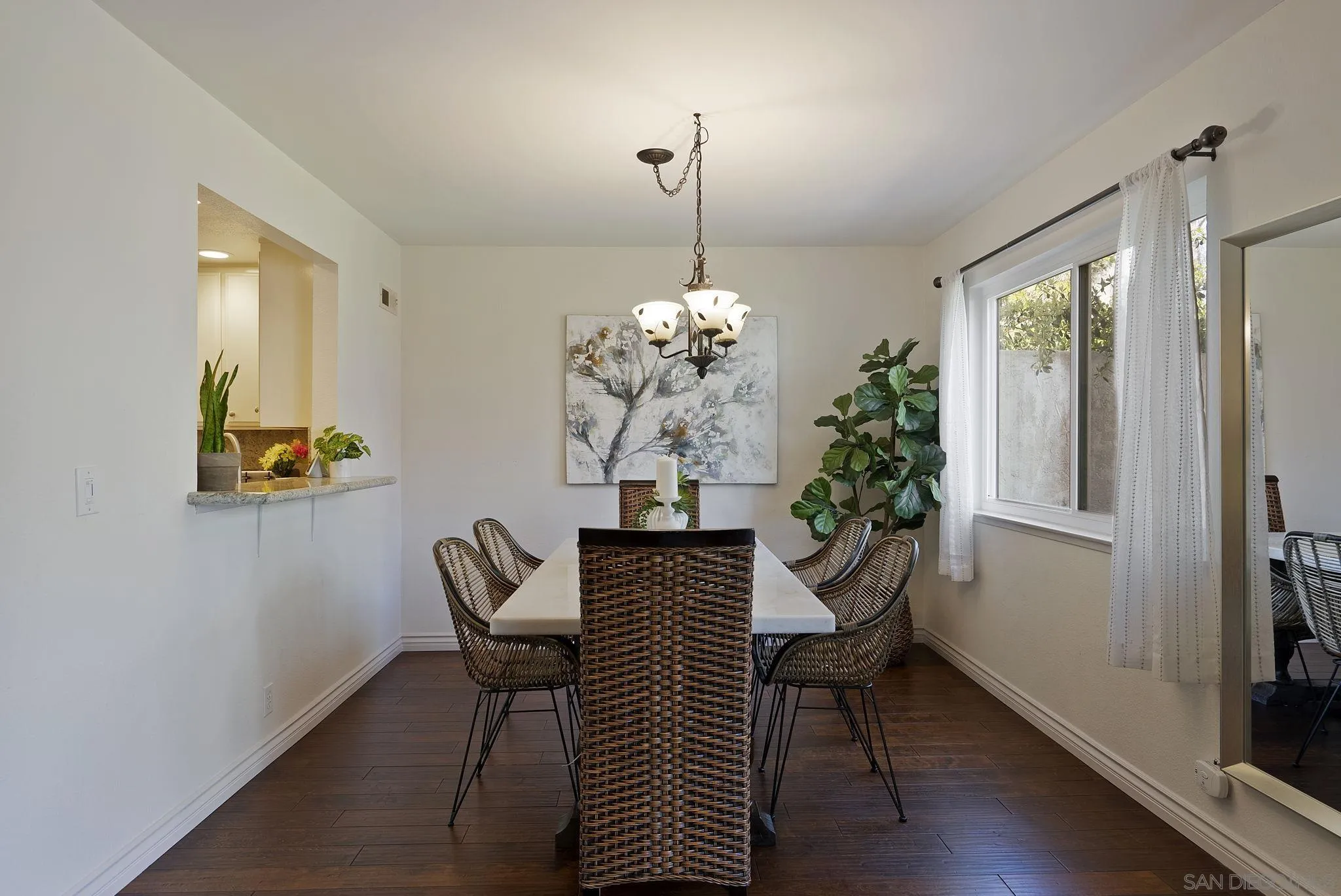 6561 Corte Cisco Carlsbad, CA 92009 - Photo 8 of 36 a view of a dining room with furniture and wooden floor