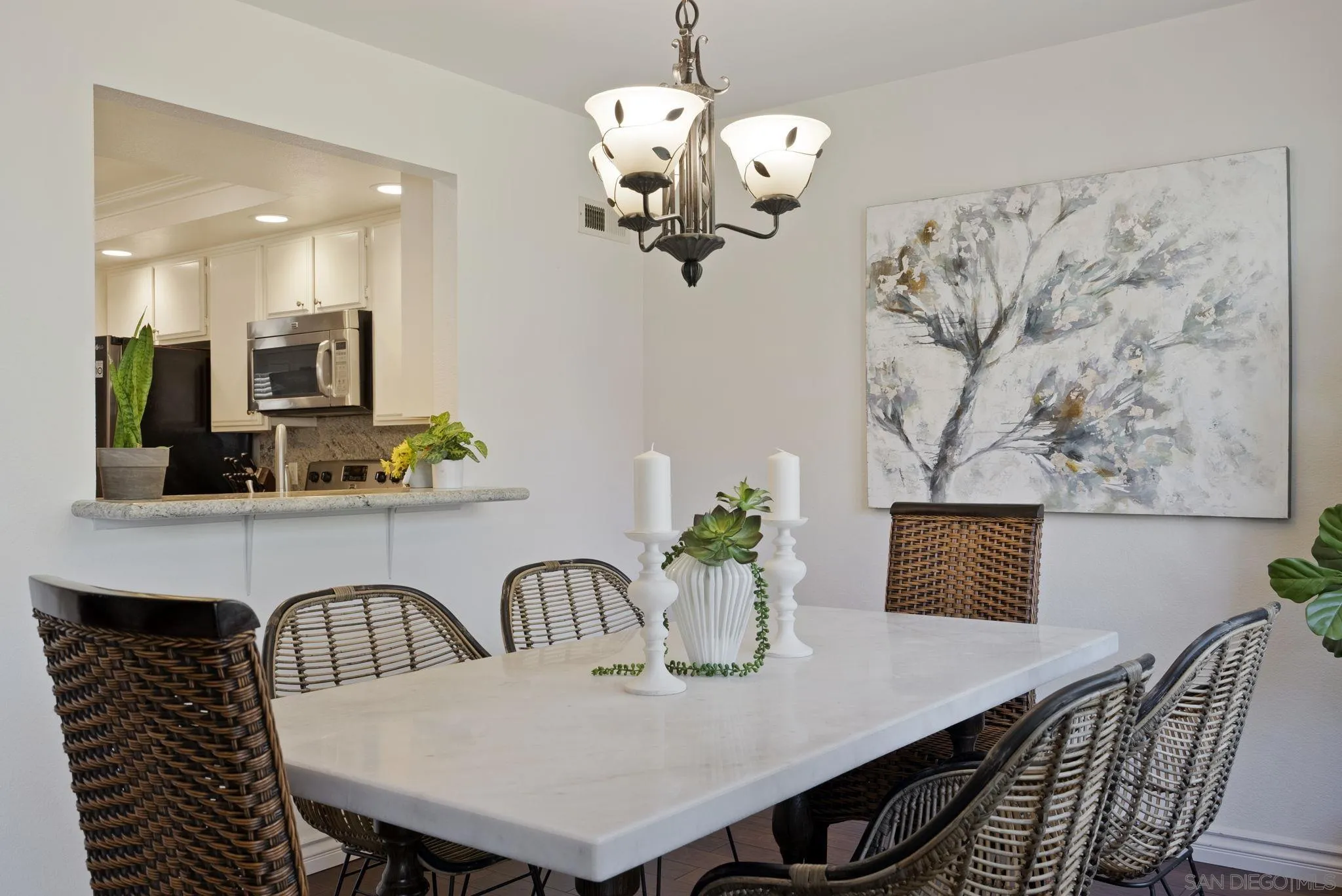 6561 Corte Cisco Carlsbad, CA 92009 - Photo 9 of 36 a view of a dining room with furniture and wooden floor