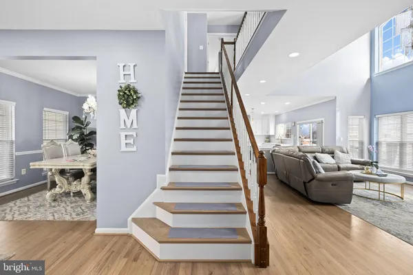 a living room with furniture and a stairs