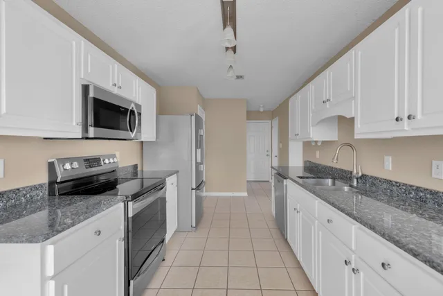 a bathroom with a toilet a sink and a window