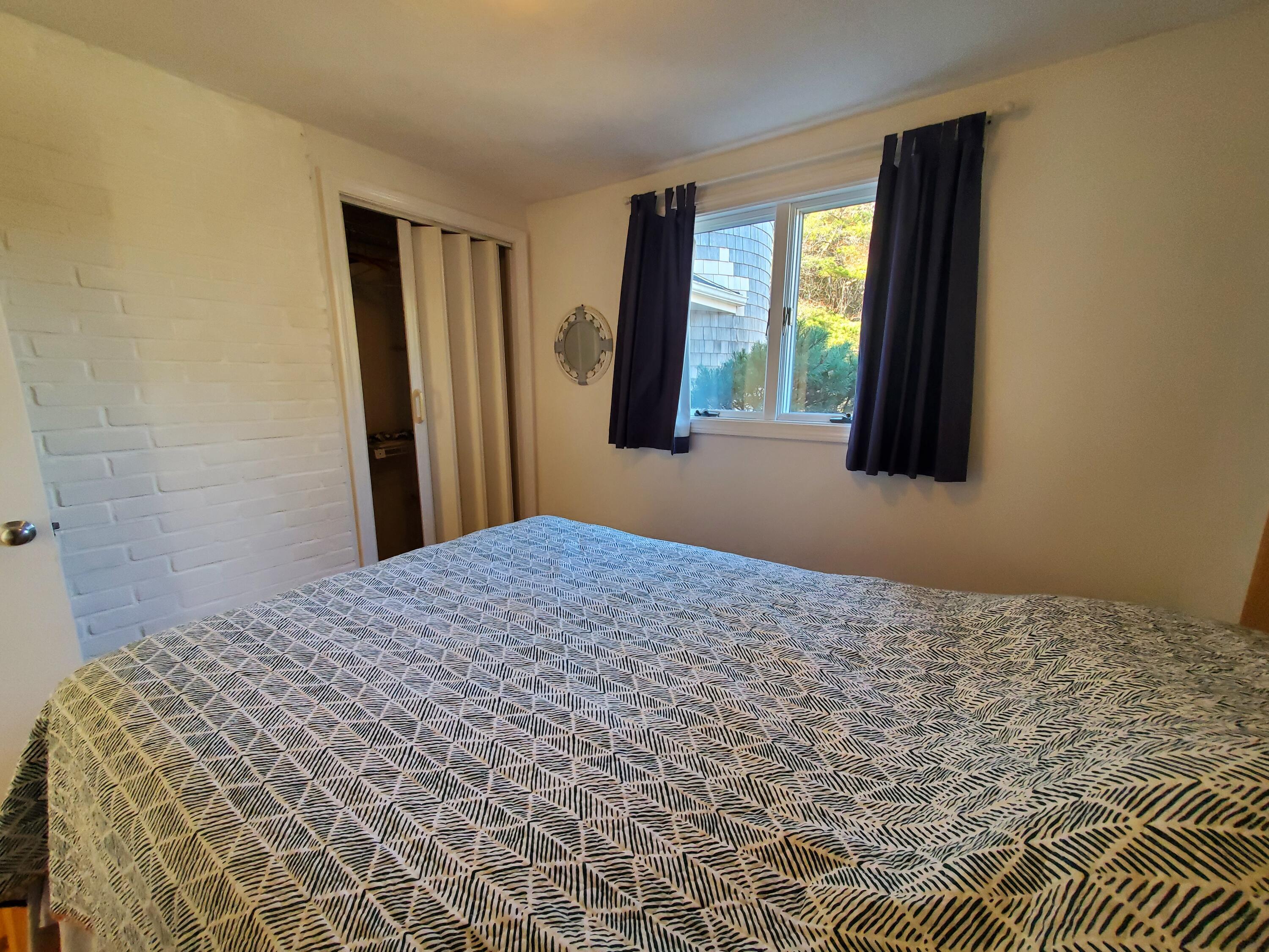 20 Spooner Road Eastham, MA 02642 - Photo 17 of 48 a bedroom with a bed and a window