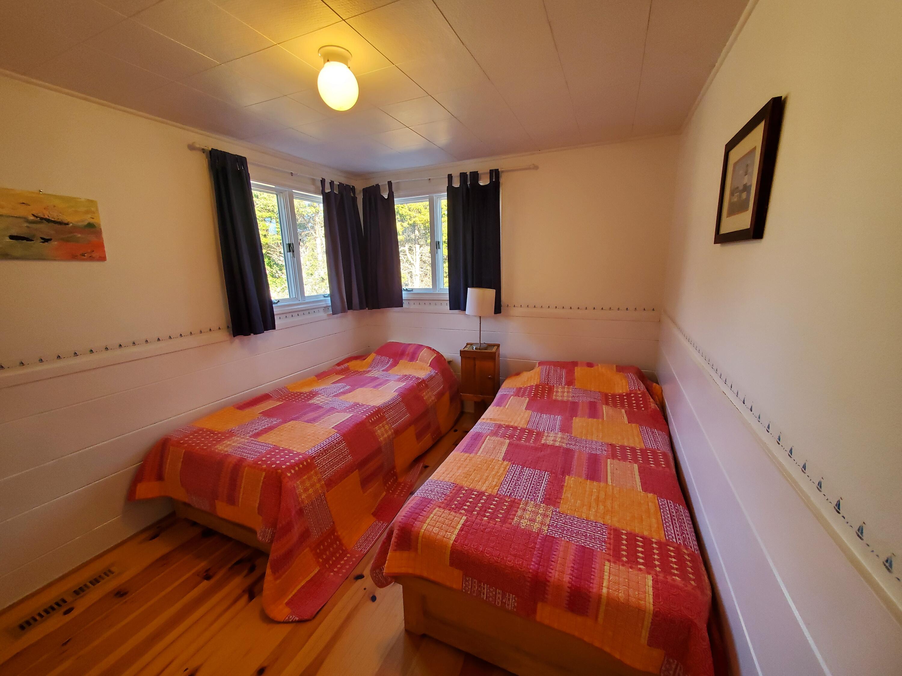 20 Spooner Road Eastham, MA 02642 - Photo 20 of 48 a bedroom with two beds and painted walls