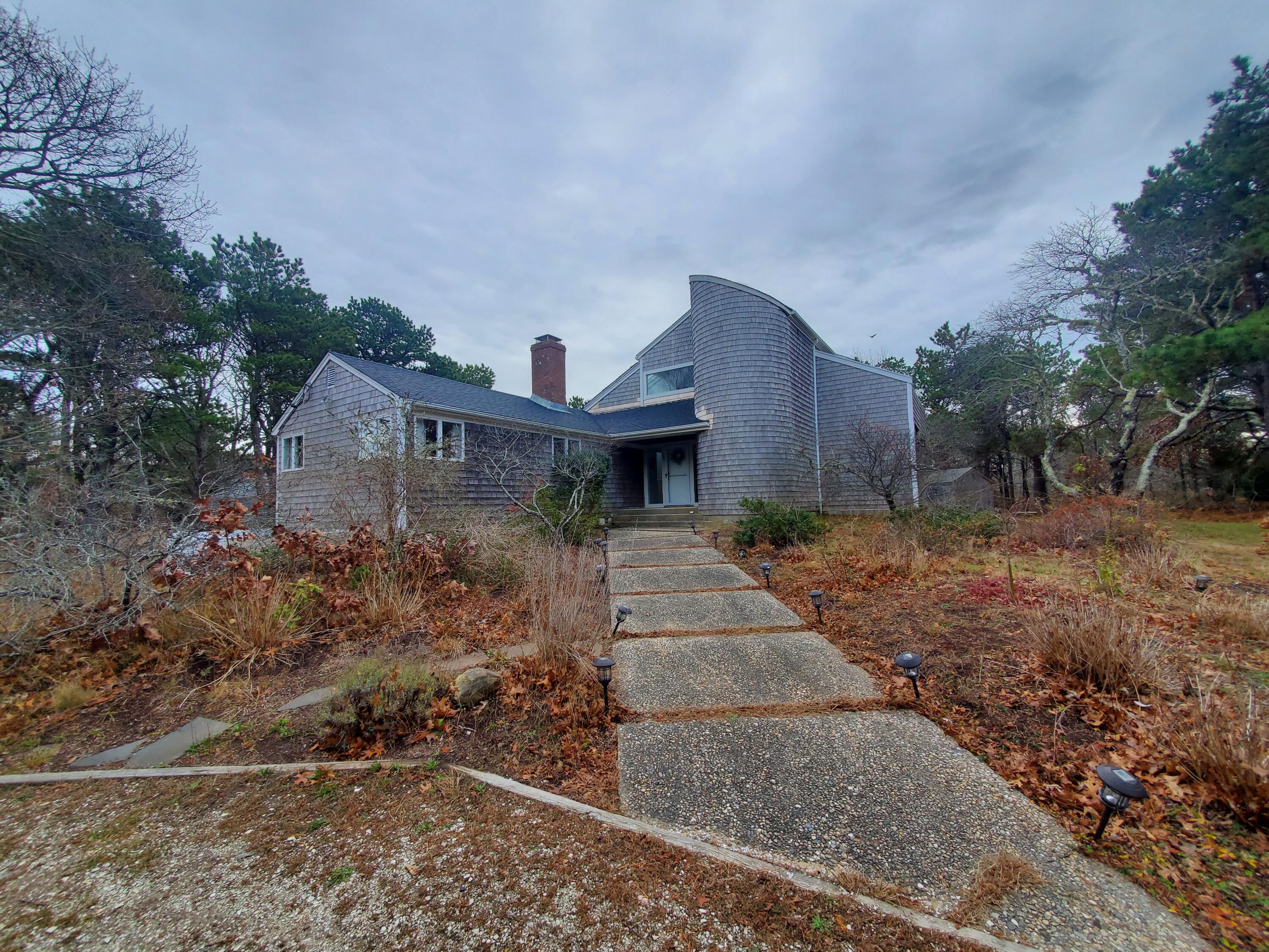 20 Spooner Road Eastham, MA 02642 - Photo 2 of 48 a view of a house with a yard and hanging chair