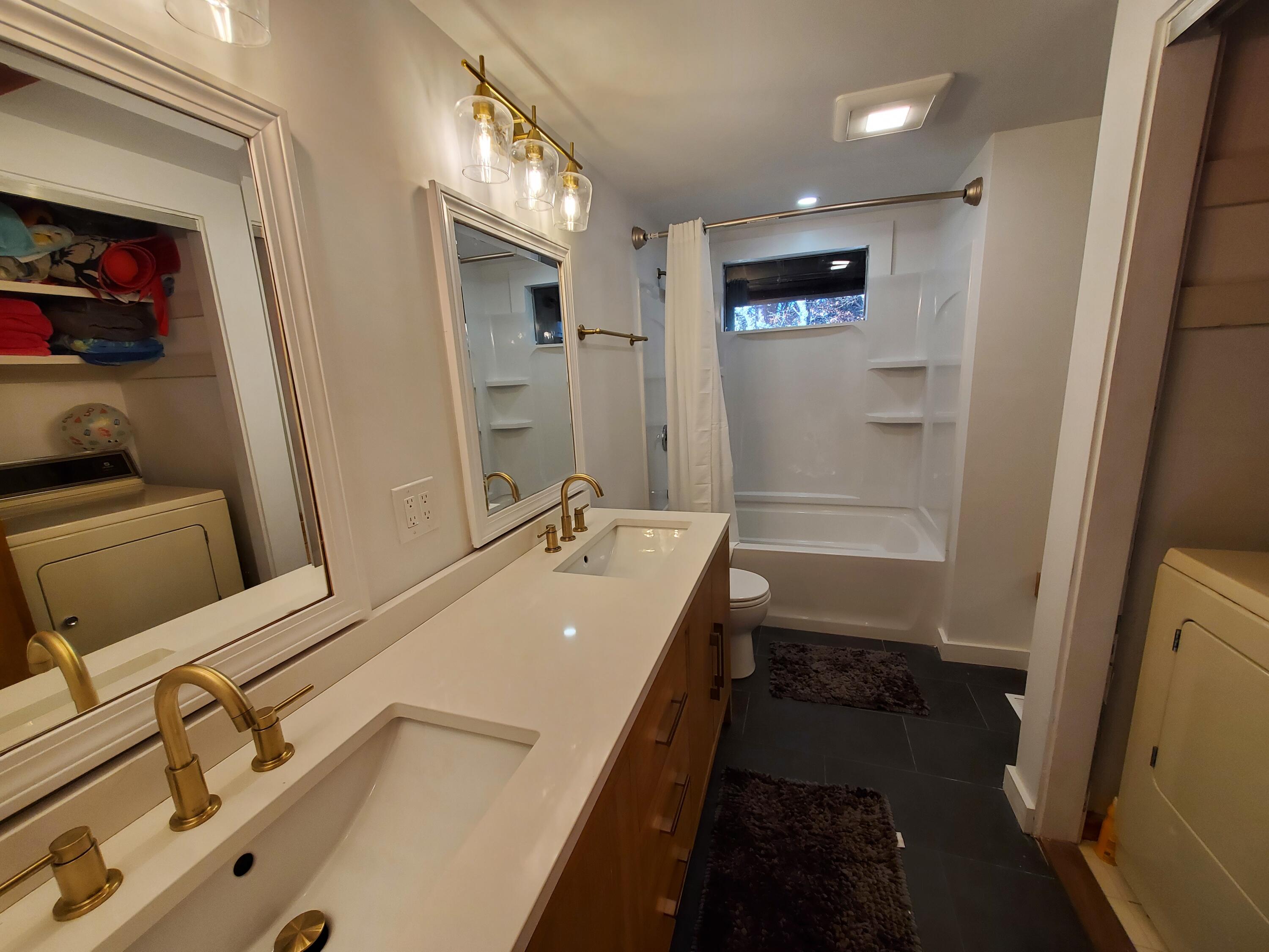 20 Spooner Road Eastham, MA 02642 - Photo 22 of 48 a bathroom with a tub sink and mirror