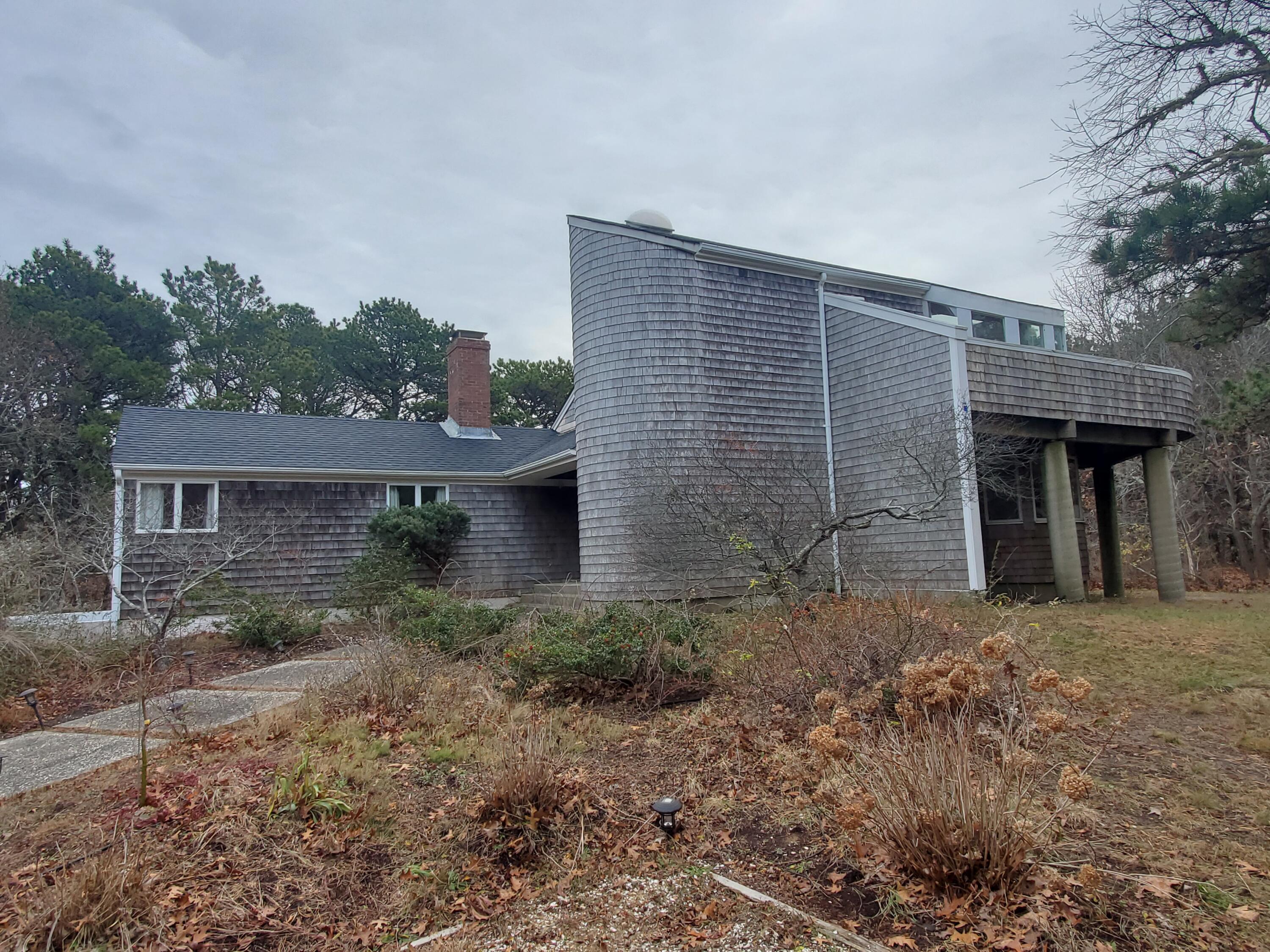20 Spooner Road Eastham, MA 02642 - Photo 3 of 48 a front view of a house with garden