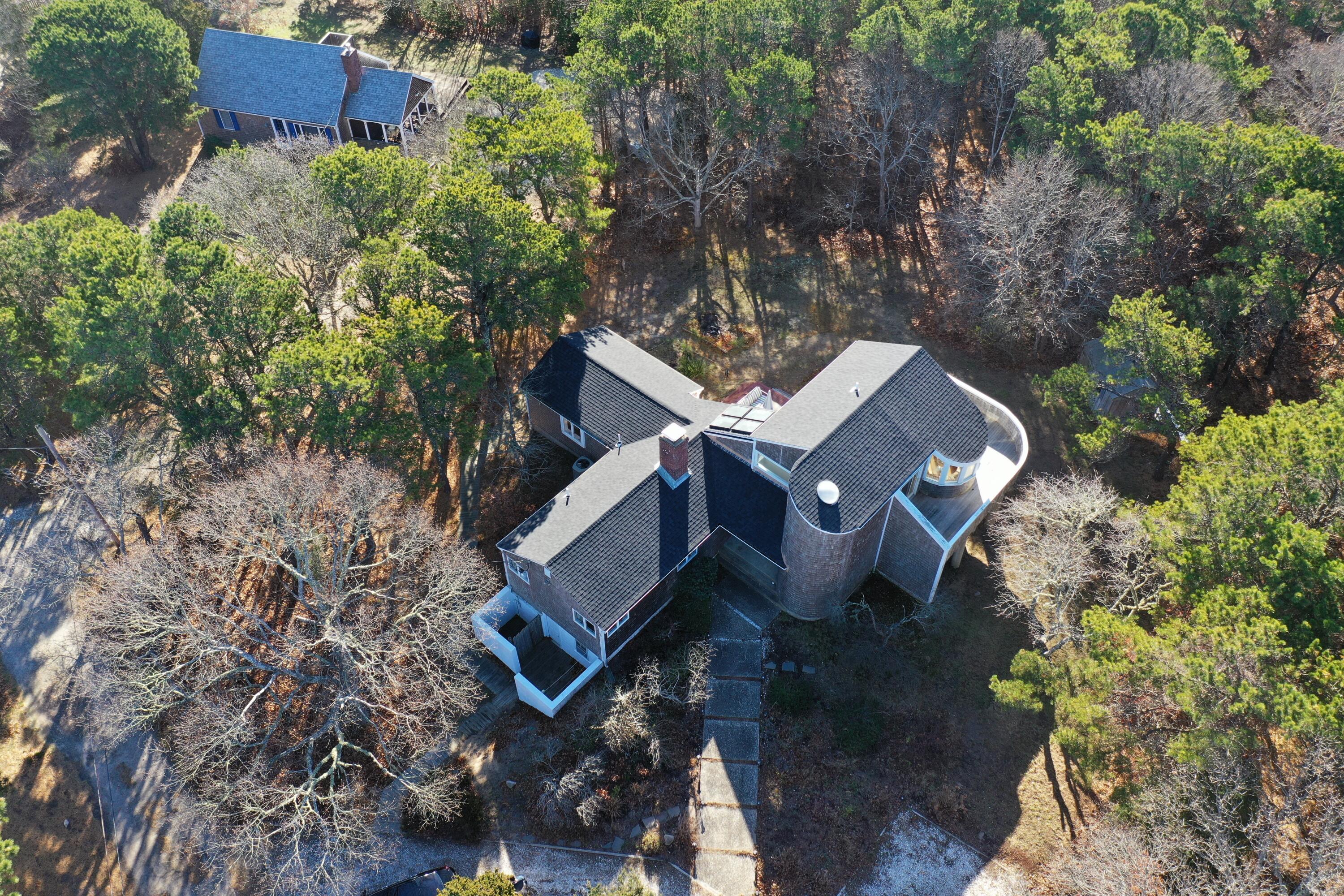 20 Spooner Road Eastham, MA 02642 - Photo 38 of 48 an aerial view of a house with yard and outdoor seating