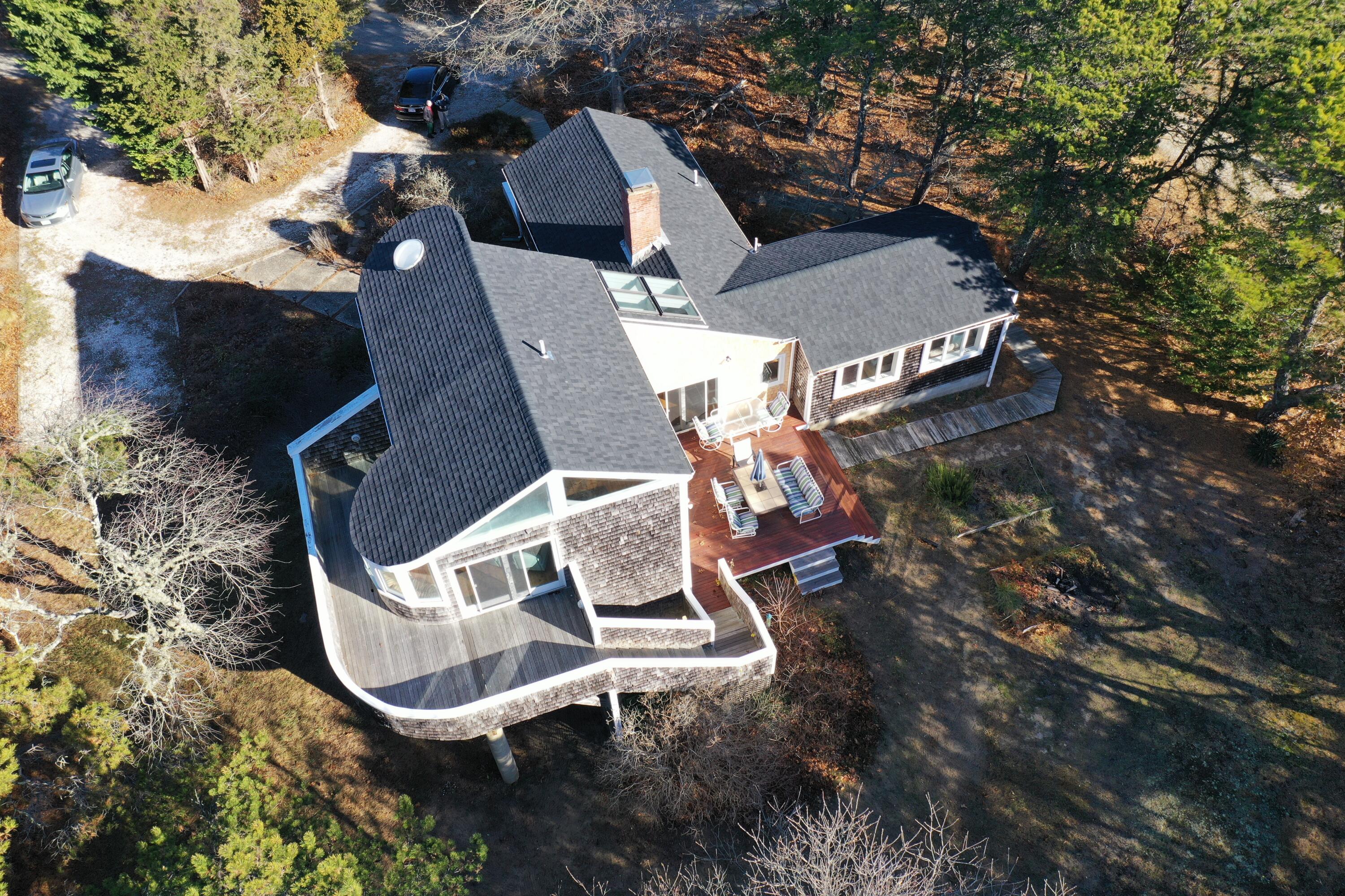 20 Spooner Road Eastham, MA 02642 - Photo 44 of 48 an aerial view of a house with swimming pool and wooden fence