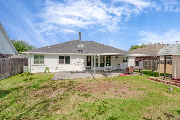a view of a house with backyard and swimming pool