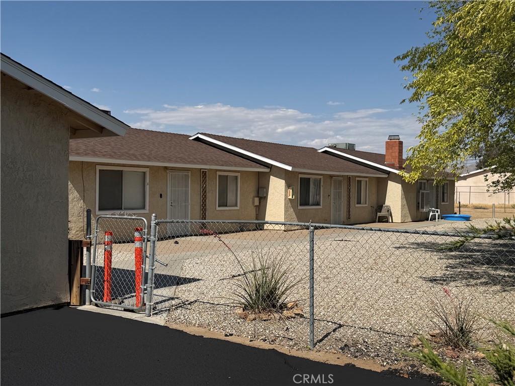 13269 Mohawk Road Apple Valley, CA 92308 - Photo 4 of 8 a view of a house with street