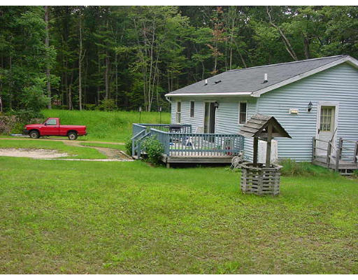 118 Wheeler Road Princeton, MA 01541 - Photo 4 of 6 a view of an house with backyard and a slide