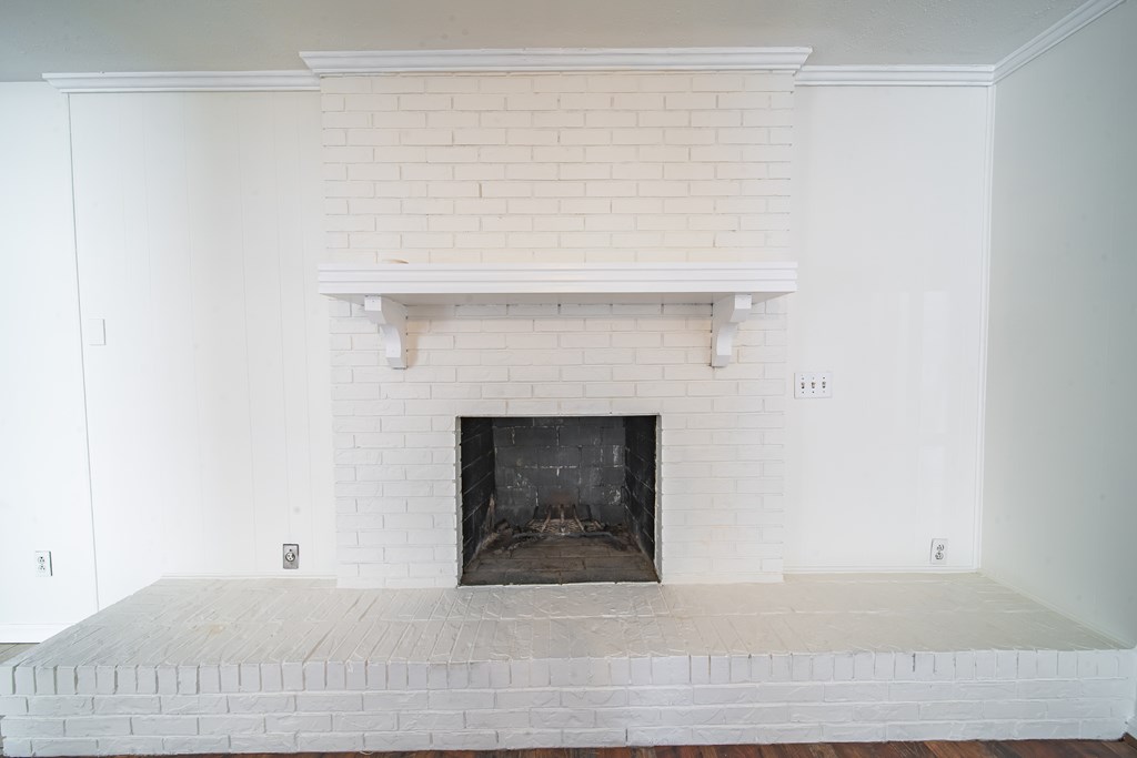 1829 Celeste Drive Columbus, GA 31907 - Photo 14 of 33 a living room with a fireplace and a table