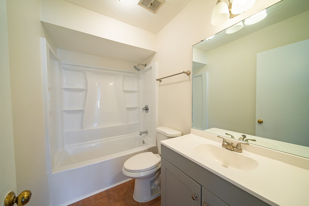 1829 Celeste Drive Columbus, GA 31907 - Photo 22 of 33 a bathroom with a sink a toilet and shower