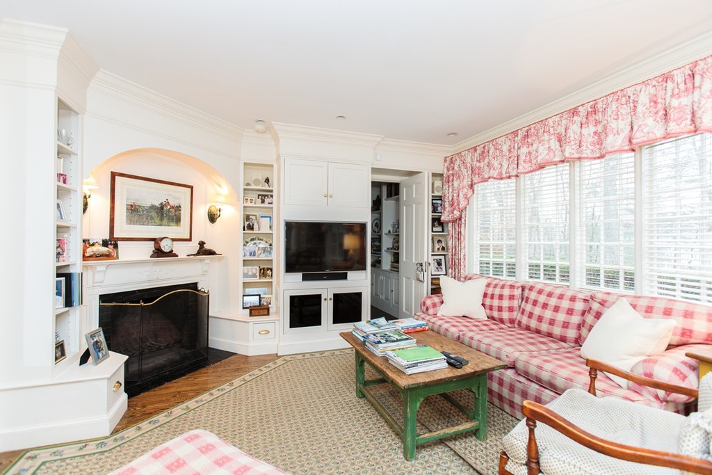 30 Old Farm Road Wellesley, MA 02481 - Photo 8 of 15 a living room with furniture a flat screen tv and a fireplace