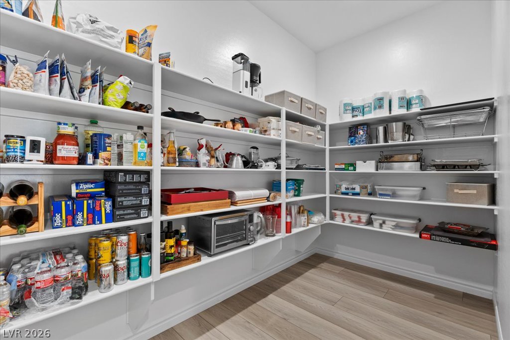 20 Charlotte Ridge Place Henderson, NV 89011 - Photo 16 of 33 An oversized walk-in pantry boasts plentiful shelving for culinary essentials and bulk provisions.