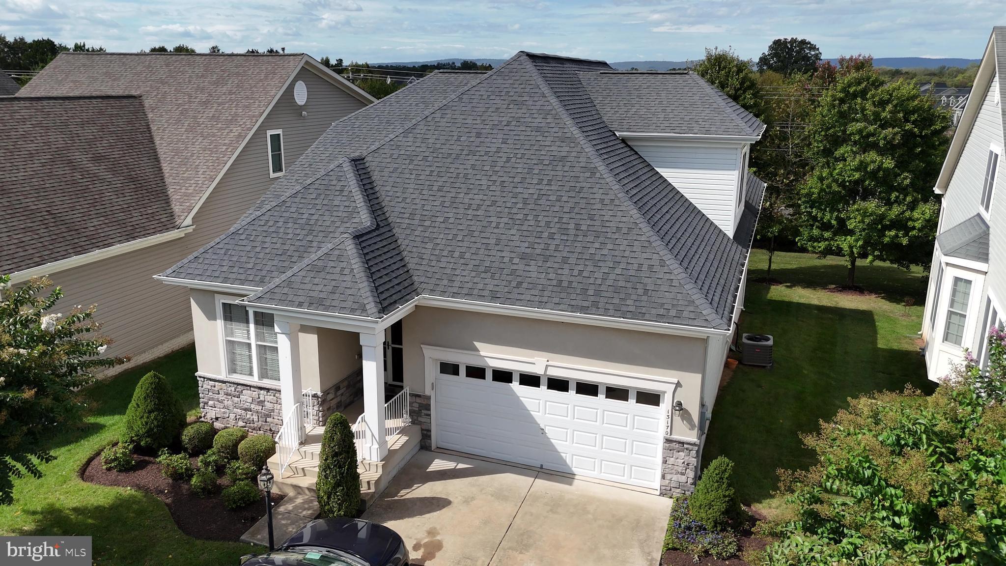 13170 Triple Crown Loop Gainesville, VA 20155 - Photo 70 of 71 an aerial view of a house with a yard and potted plants
