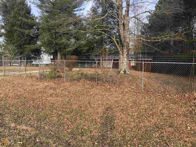 a view of backyard with green space