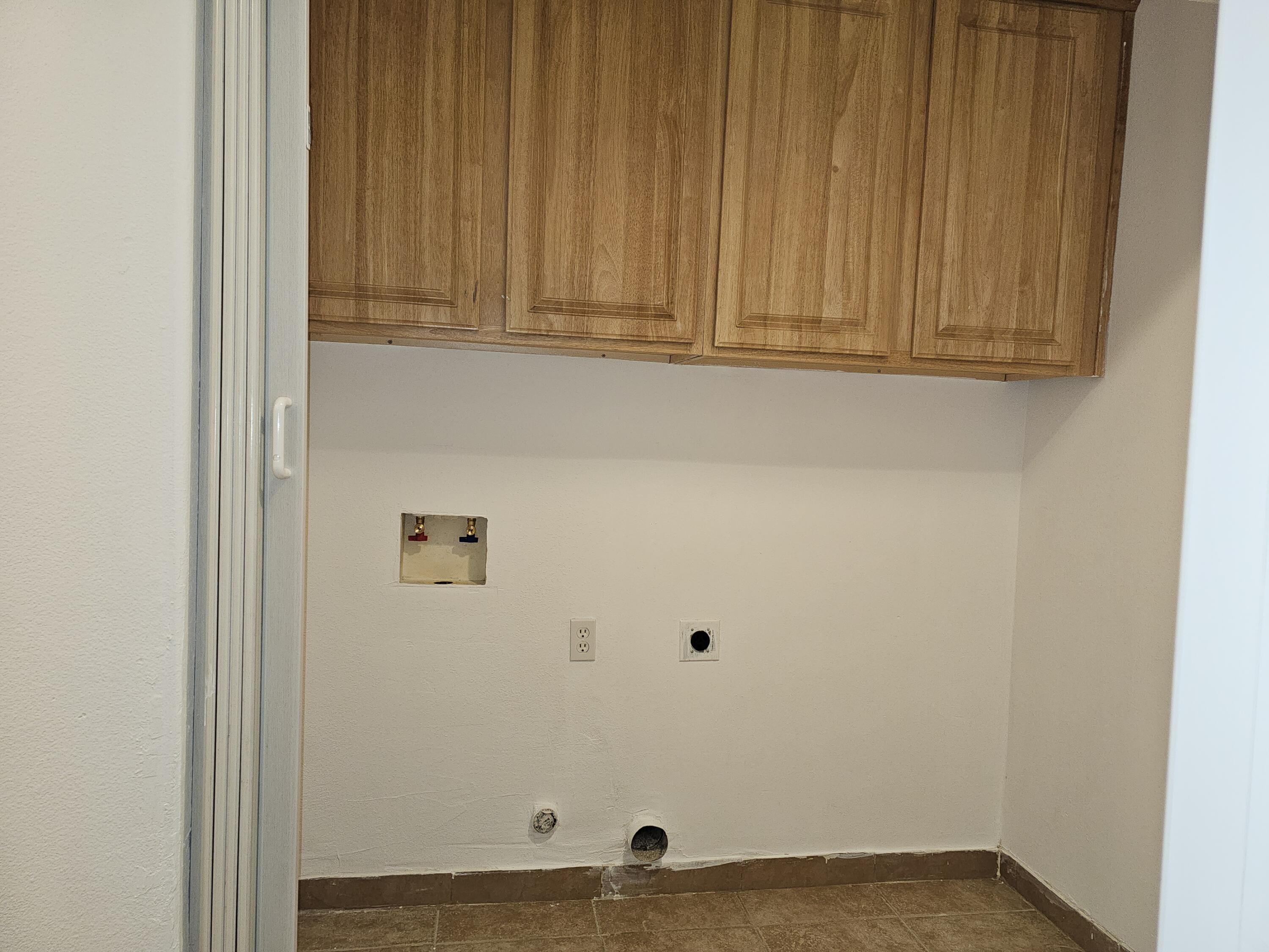 2799 Jester Avenue Thermal, CA 92274 - Photo 9 of 16 a view of door with washer and dryer