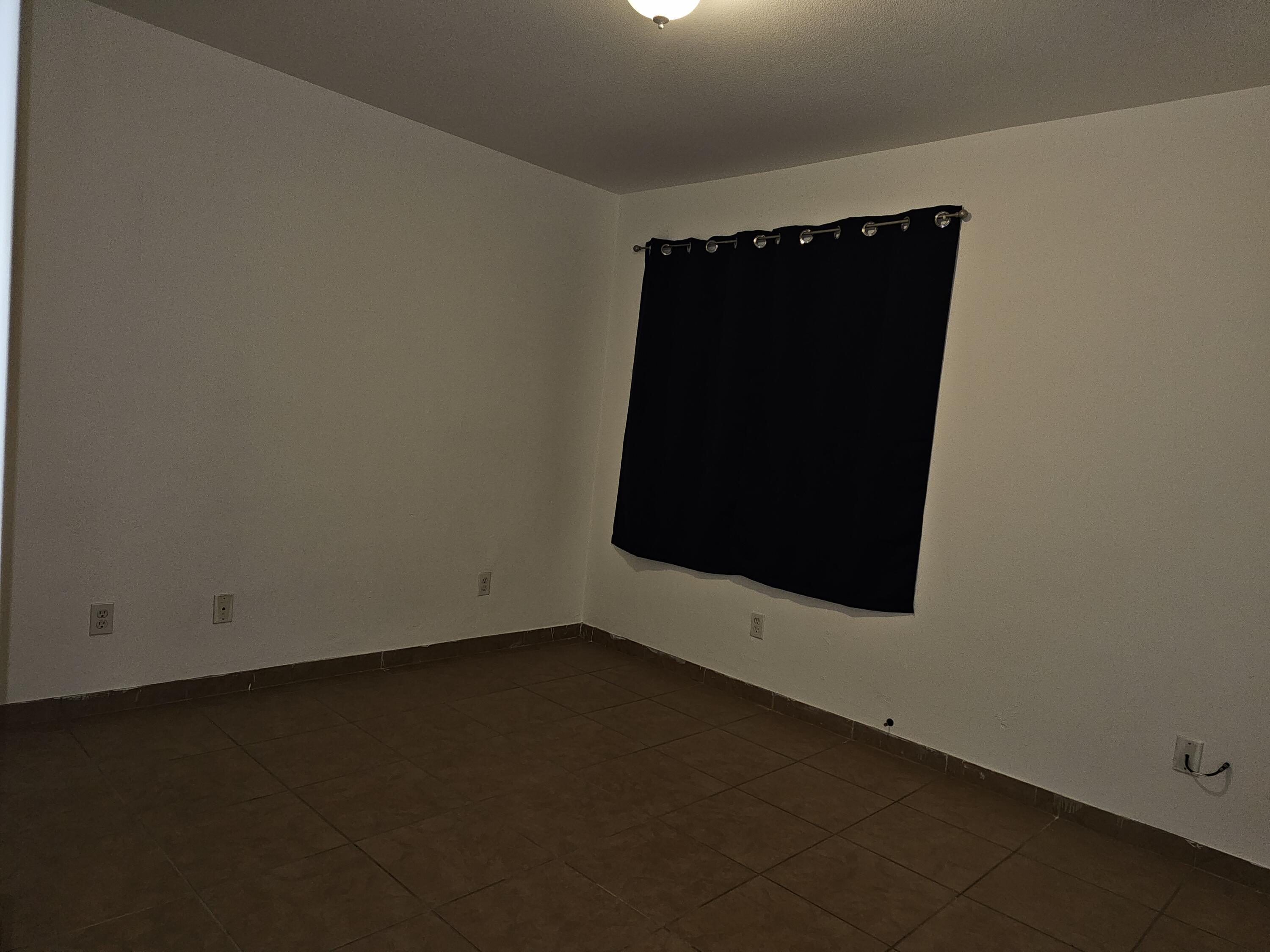 2799 Jester Avenue Thermal, CA 92274 - Photo 10 of 16 an empty room with wooden floor and a window