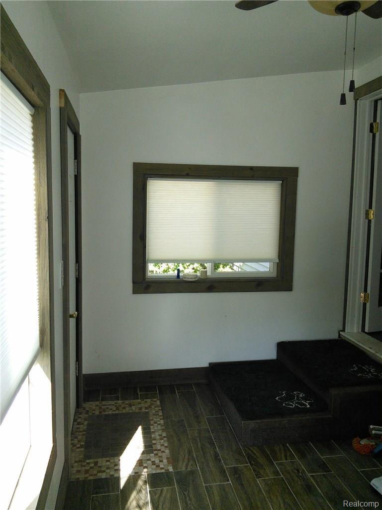 4400 Van Slyke Road Flint, MI 48507 - Photo 20 of 26 Enclosed porch to backyard from kitchen