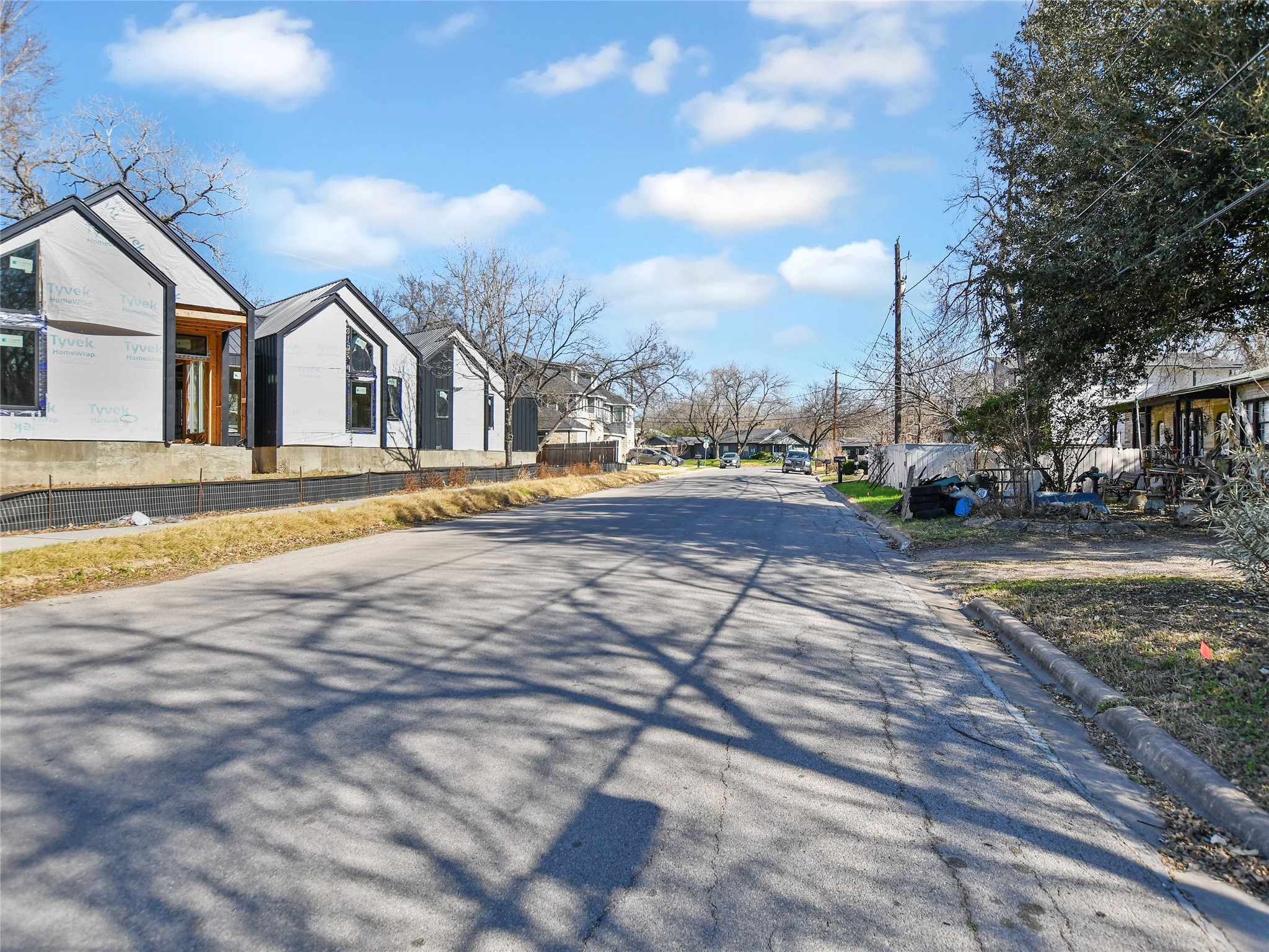 5405 Prock Lane Austin, TX 78721 - Photo 6 of 13 a view of road with yard and car parked