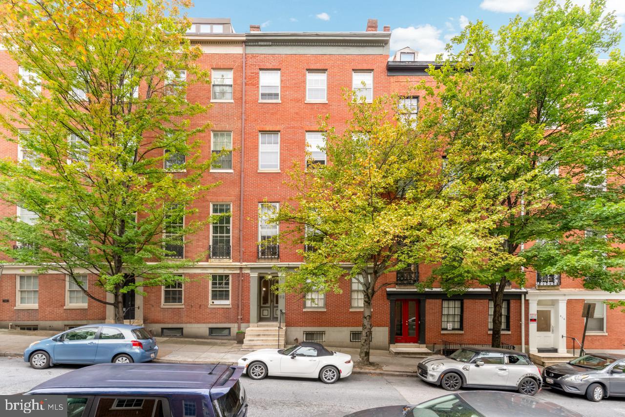 512 Cathedral Street, Unit 3 Baltimore, MD 21201 - Photo 2 of 38 a front view of a building with trees