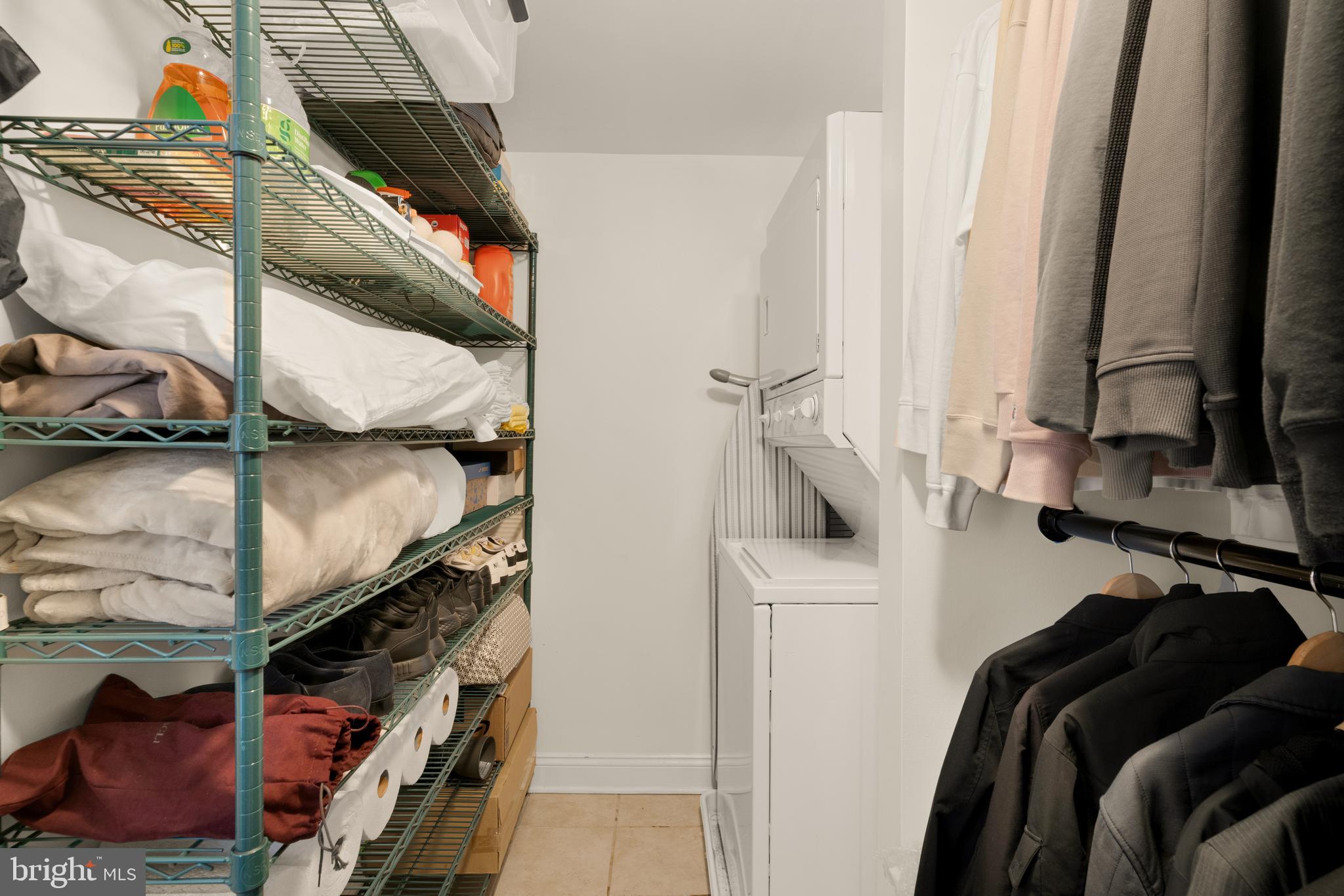 512 Cathedral Street, Unit 3 Baltimore, MD 21201 - Photo 25 of 38 a view of walk in closet with clothes and shoes