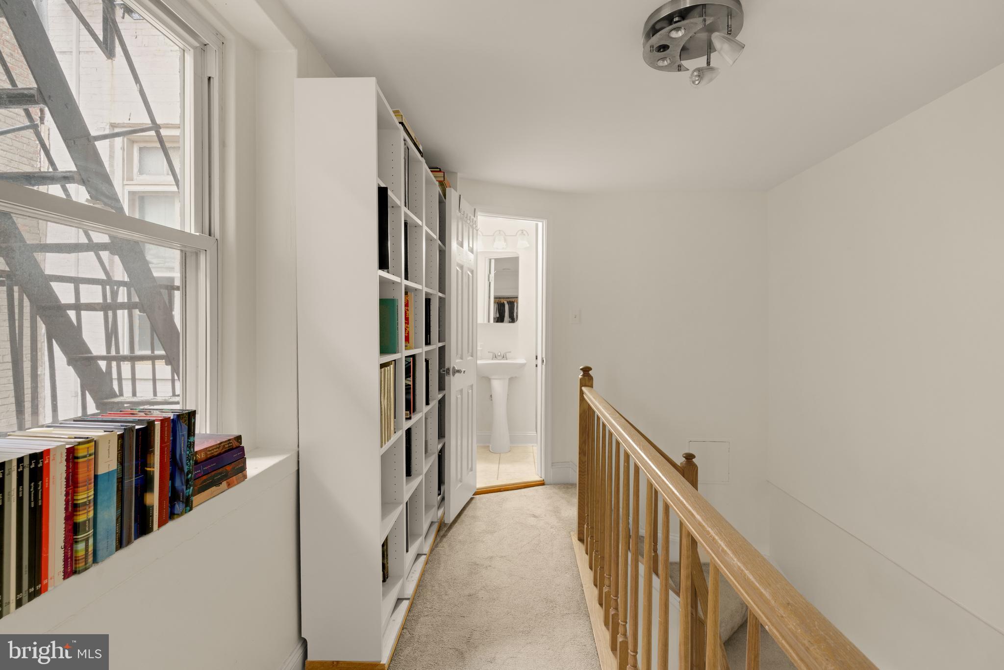 512 Cathedral Street, Unit 3 Baltimore, MD 21201 - Photo 26 of 38 a view of a hallway with windows