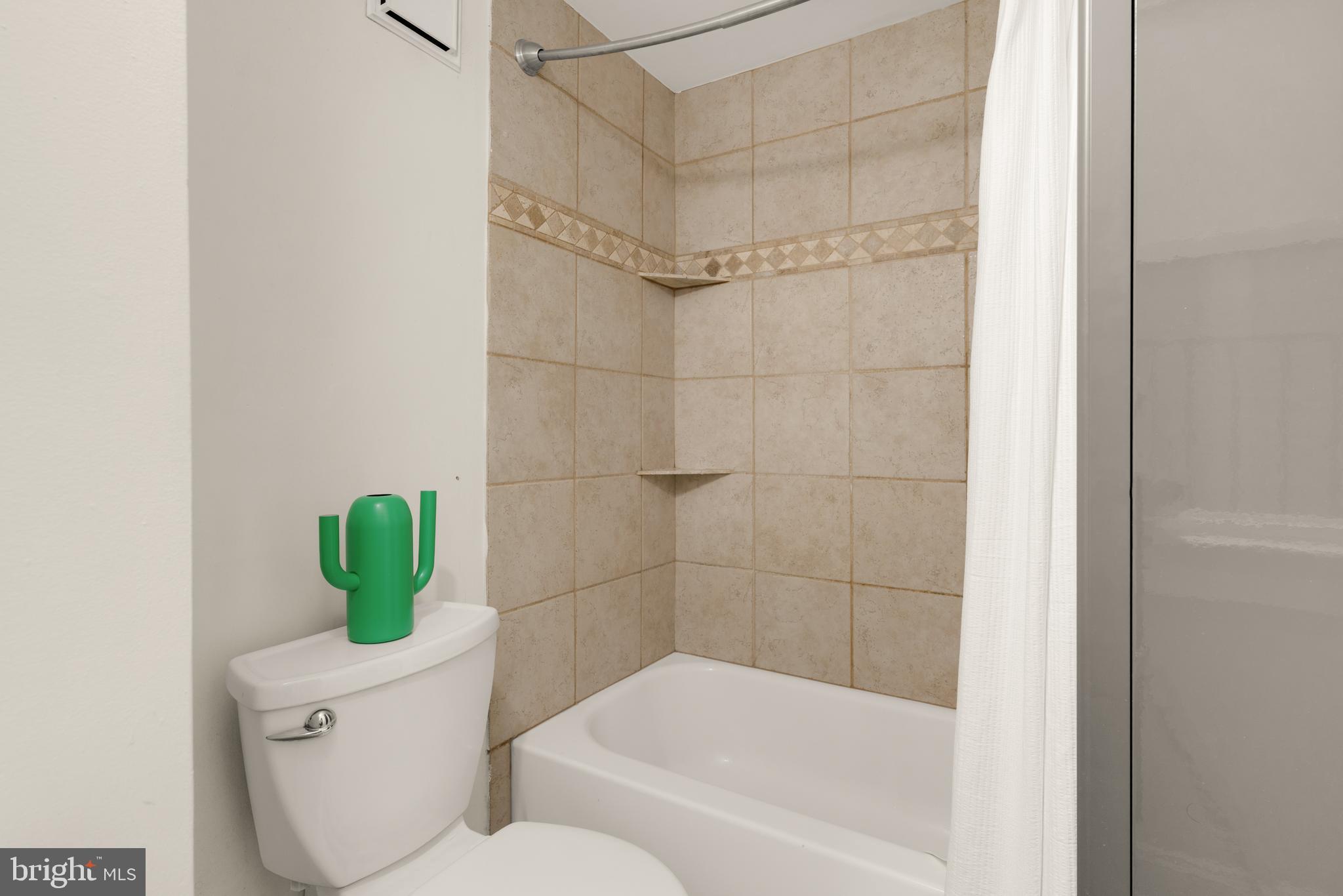512 Cathedral Street, Unit 3 Baltimore, MD 21201 - Photo 28 of 38 a bathroom with a shower and a toilet
