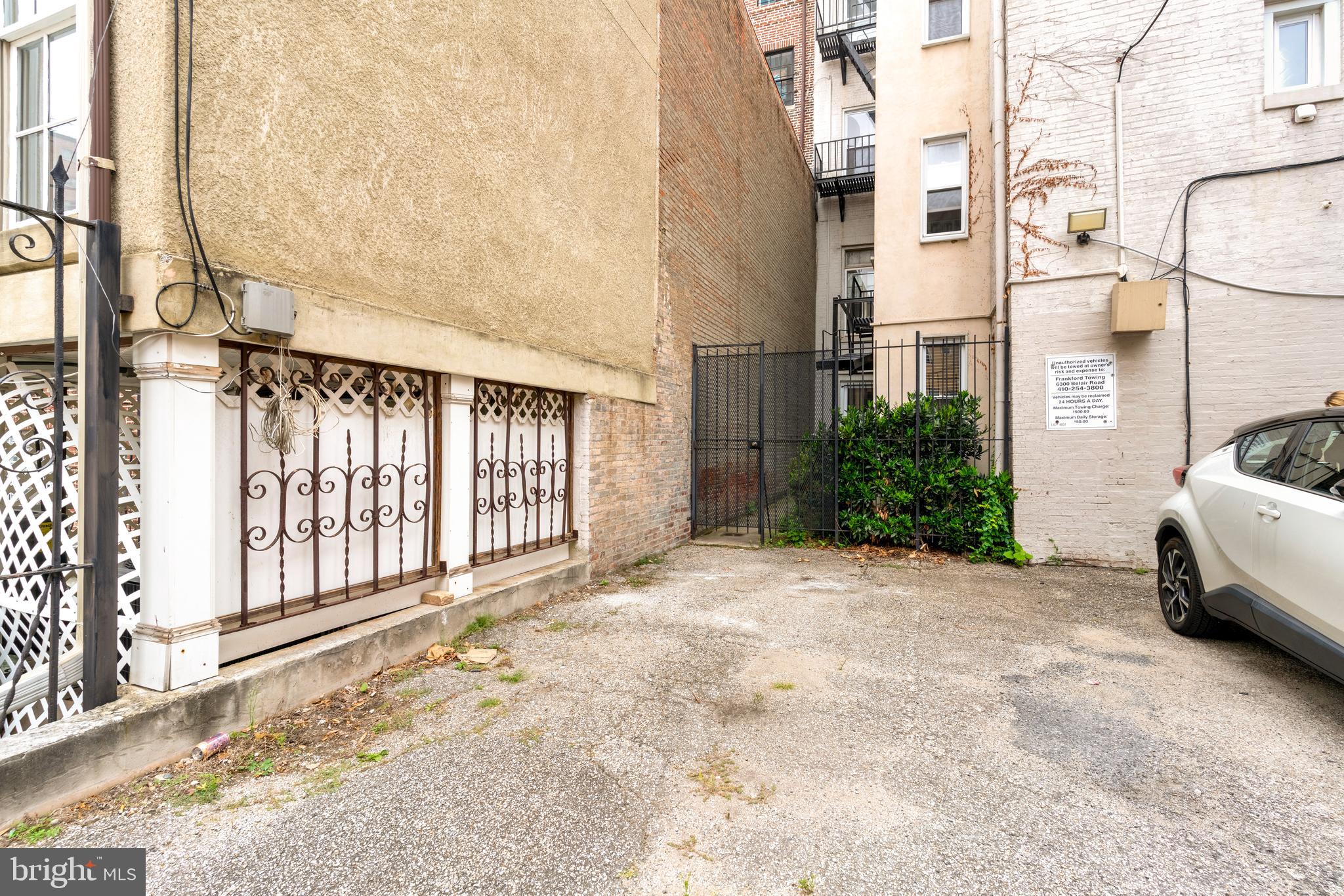 512 Cathedral Street, Unit 3 Baltimore, MD 21201 - Photo 31 of 38 a view of a house with a yard and pathway