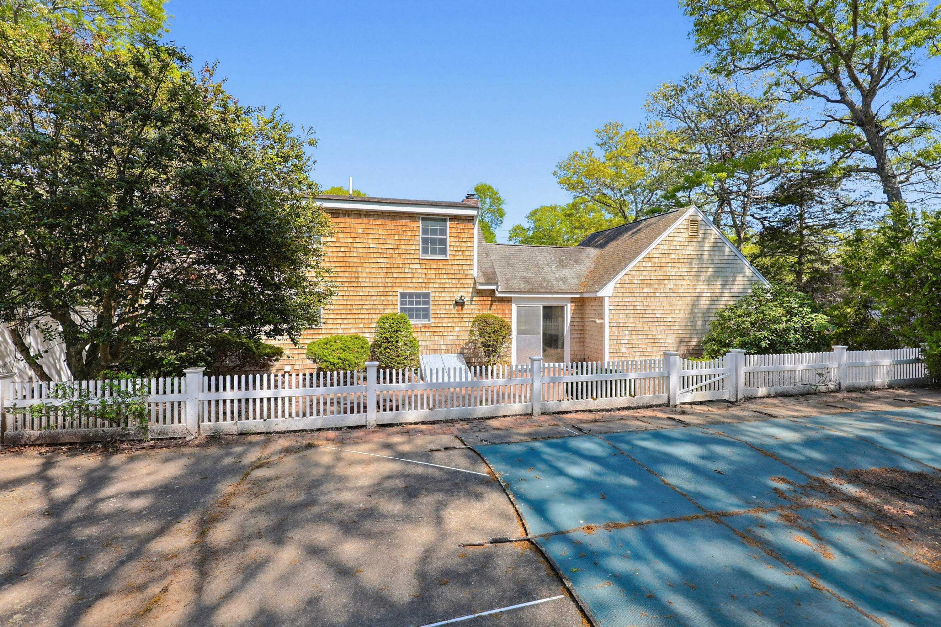 556 Cotuit Road Mashpee, MA 02649 - Photo 36 of 45 a view of a house with a small yard