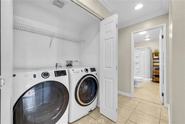 a bathroom with a double vanity sink mirror double and shower