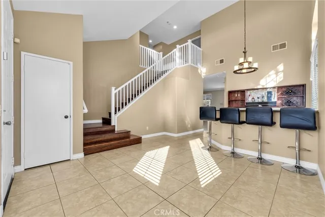 a view of a livingroom with a fireplace and a kitchen