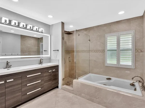 a bathroom with a shower a toilet and a window